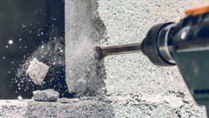 Using drill machine for concrete wall